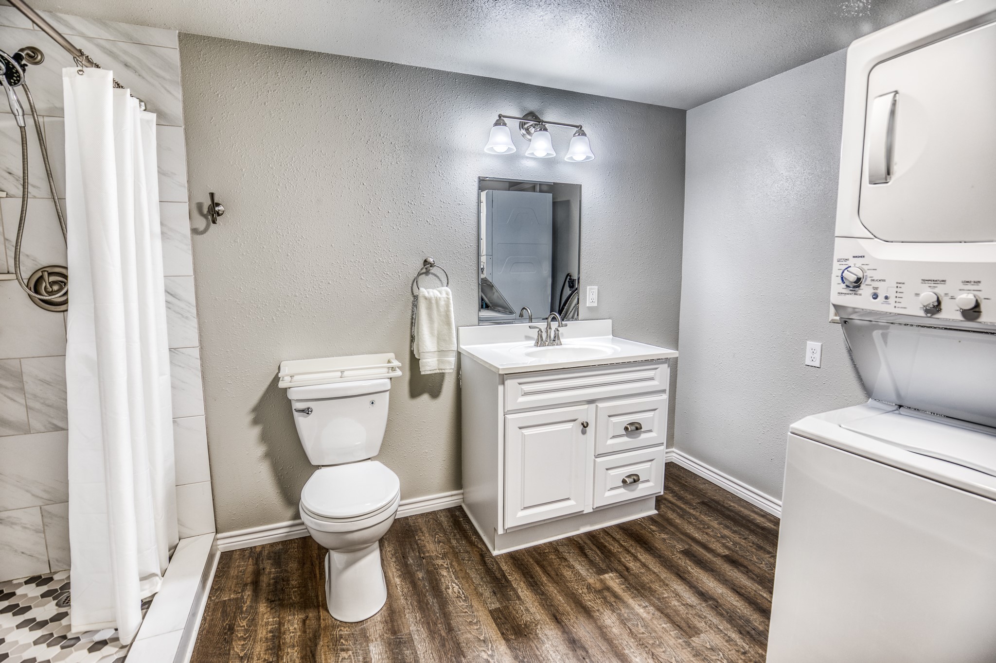 677 Grubbs Road Sealy, TX 77474 - Photo 35 of 40 a bathroom with a toilet sink and mirror