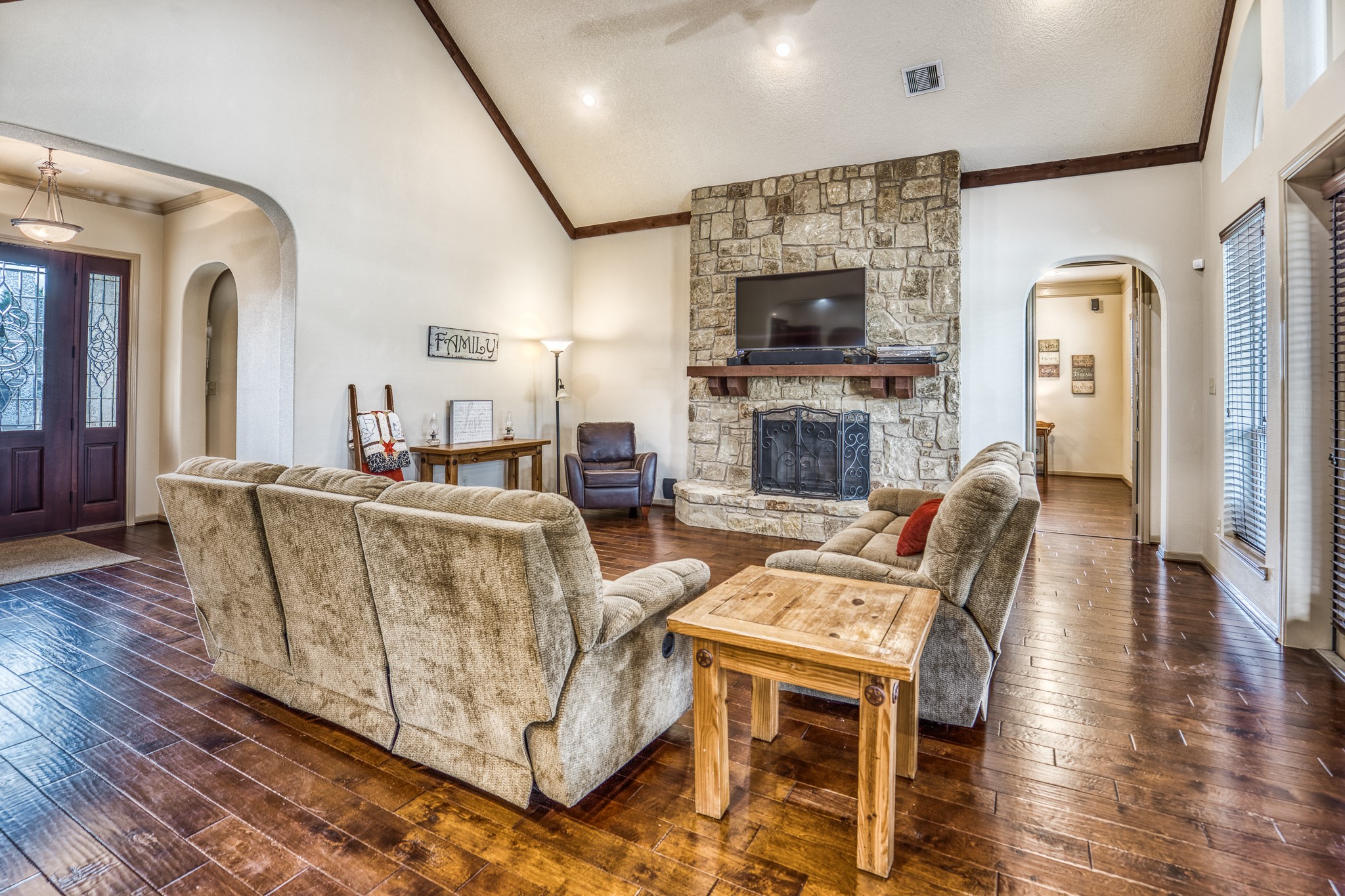 677 Grubbs Road Sealy, TX 77474 - Photo 6 of 40 a living room with fireplace furniture and a flat screen tv