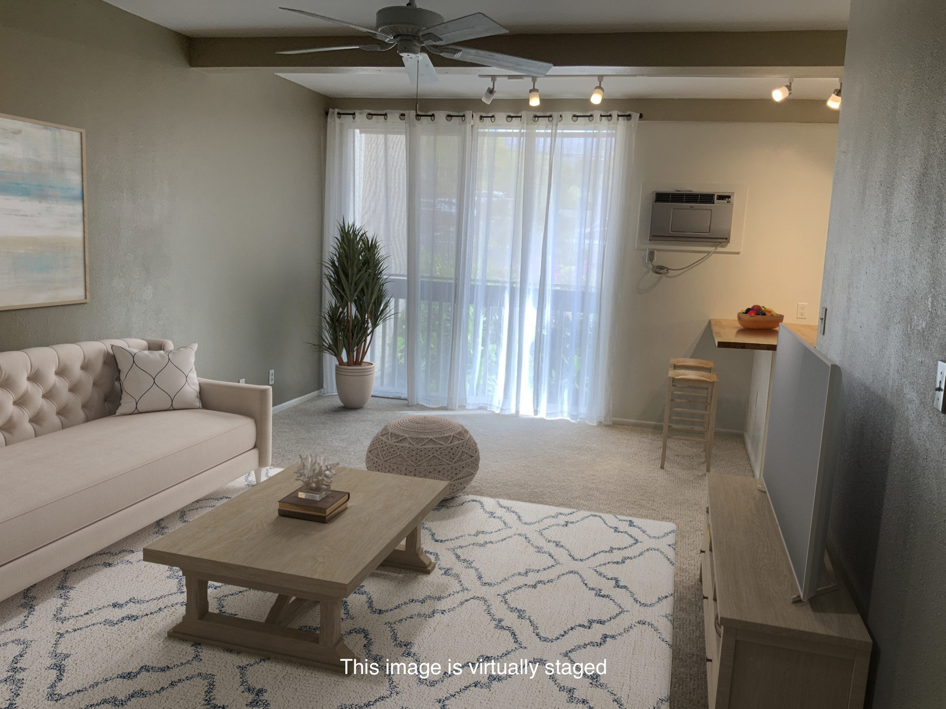 75-5873 Walua Road, Unit 118 Kailua-Kona, HI 96740 - Photo 4 of 11 a living room with furniture and a chandelier