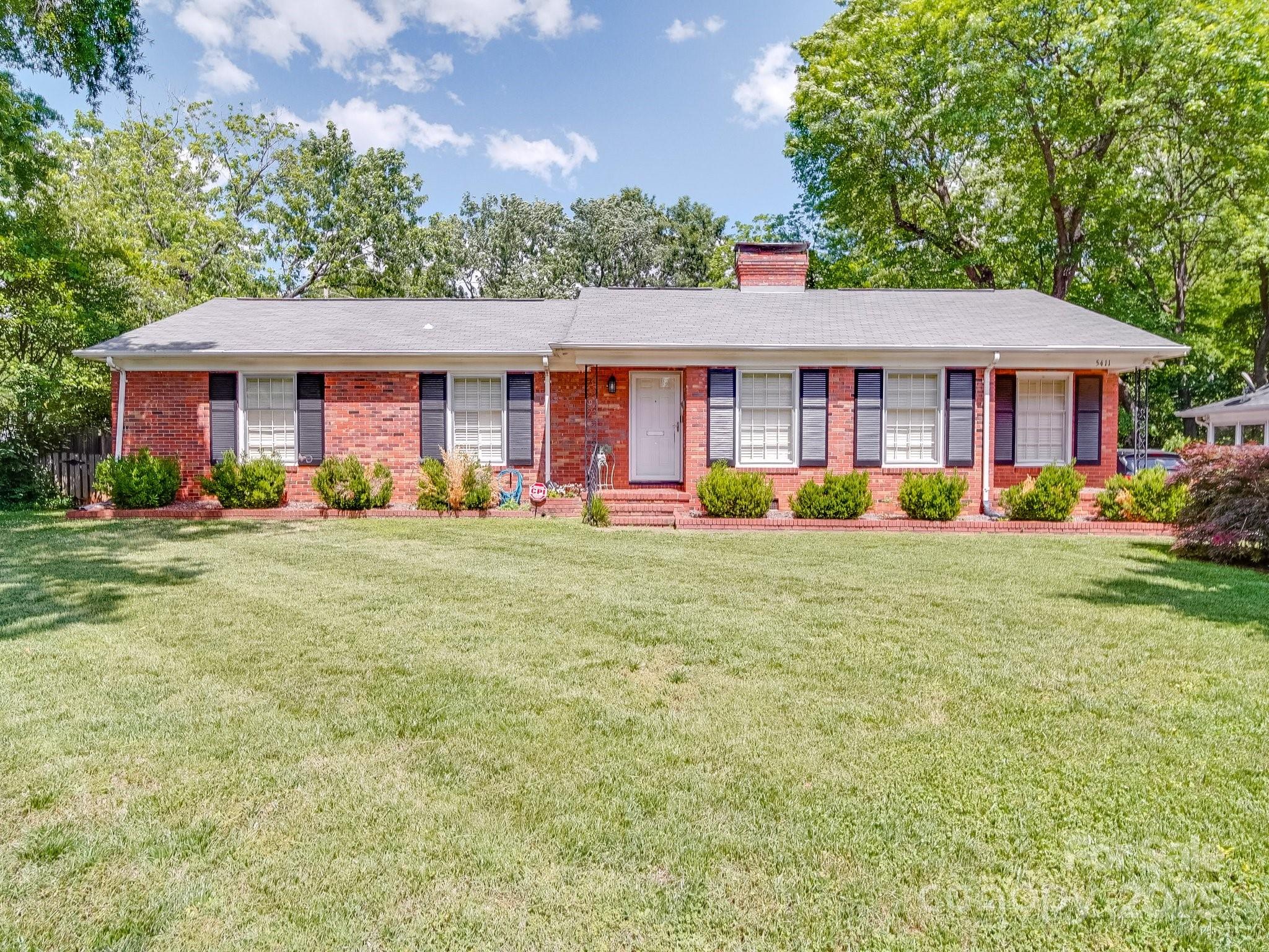 5411 Valley Forge Road Charlotte, NC 28210 - Photo 1 of 20 a front view of house with yard and green space