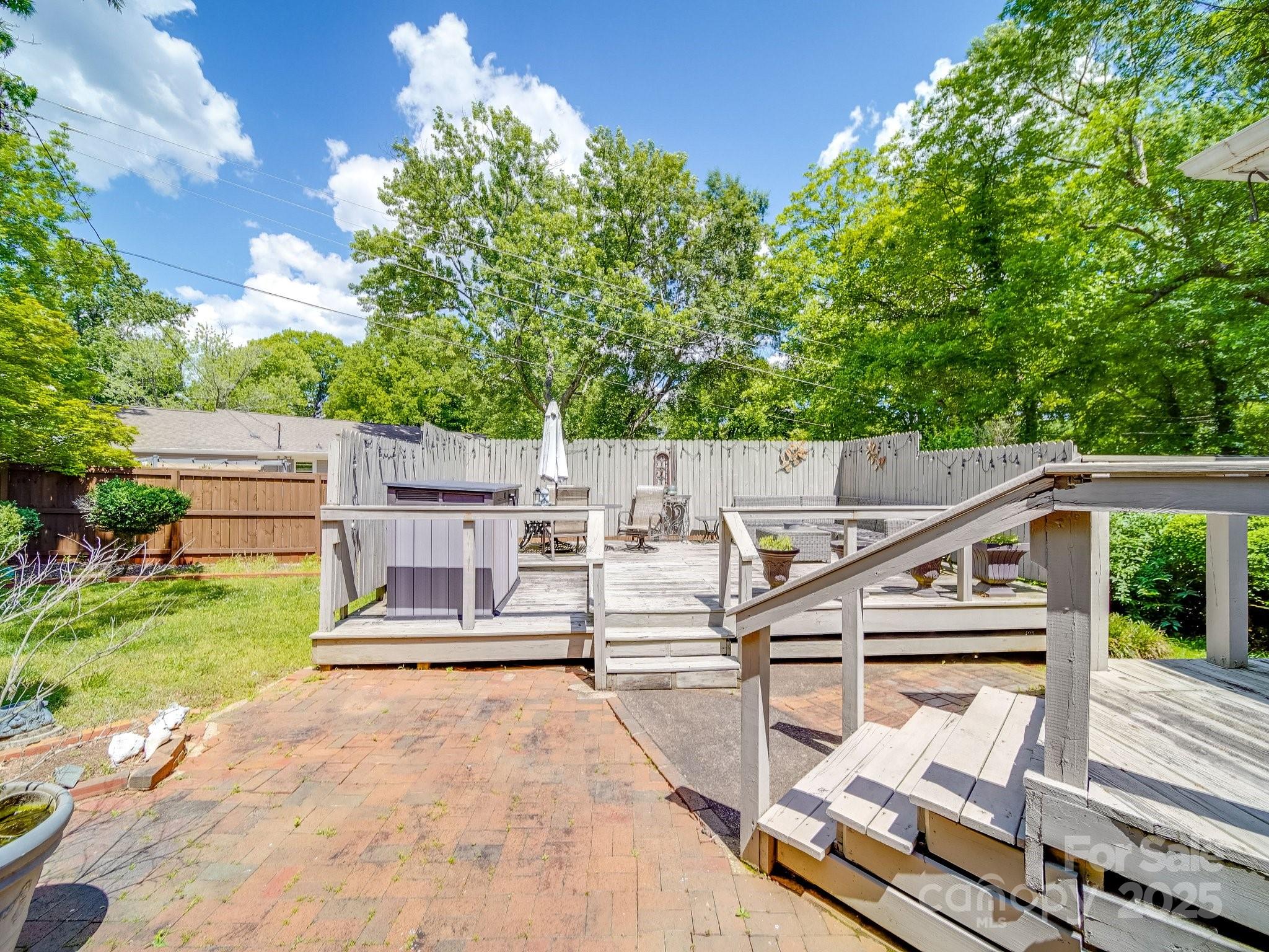 5411 Valley Forge Road Charlotte, NC 28210 - Photo 20 of 20 a view of a patio with table and chairs with wooden floor and fence