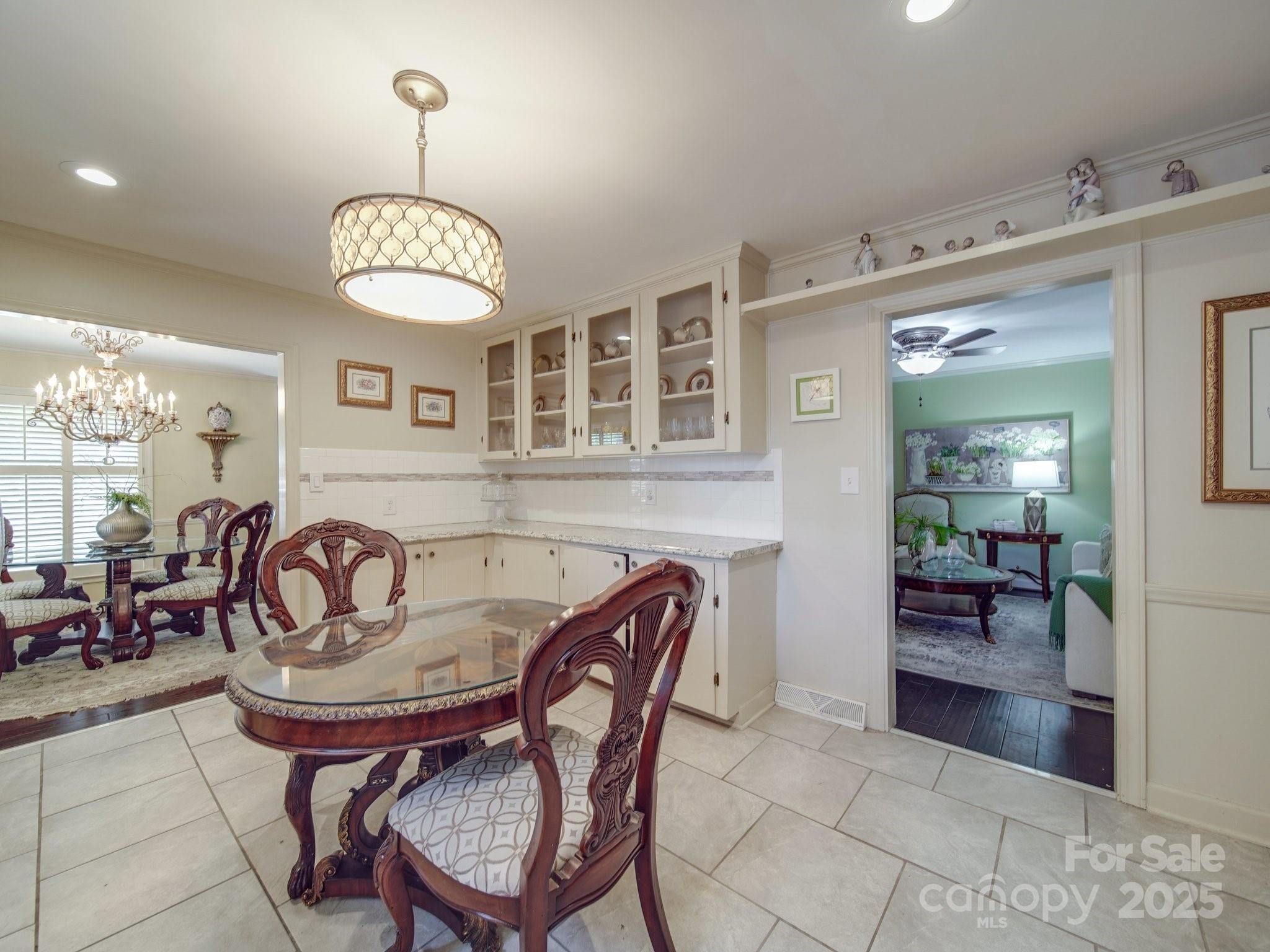 5411 Valley Forge Road Charlotte, NC 28210 - Photo 6 of 20 a view of a dining room with furniture and chandelier