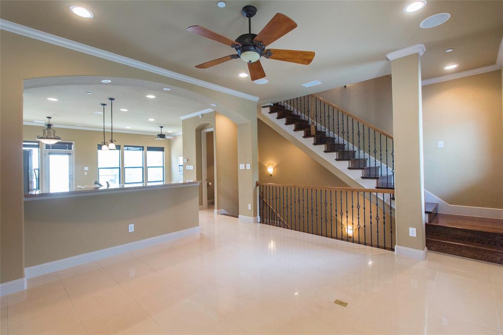 7416 Bishop Road Plano, TX 75024 - Photo 17 of 40 a view of a livingroom with a ceiling fan and window