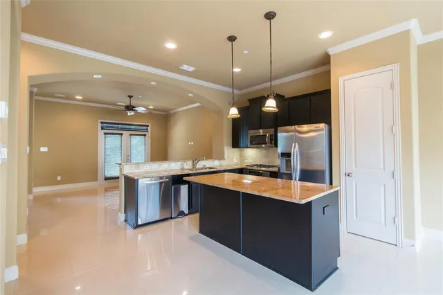 a large kitchen with a large island in the center