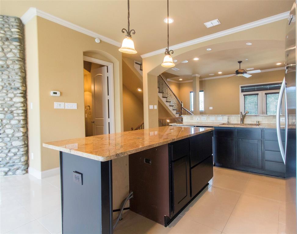 7416 Bishop Road Plano, TX 75024 - Photo 24 of 40 a bathroom with a granite countertop sink a large mirror and a shower