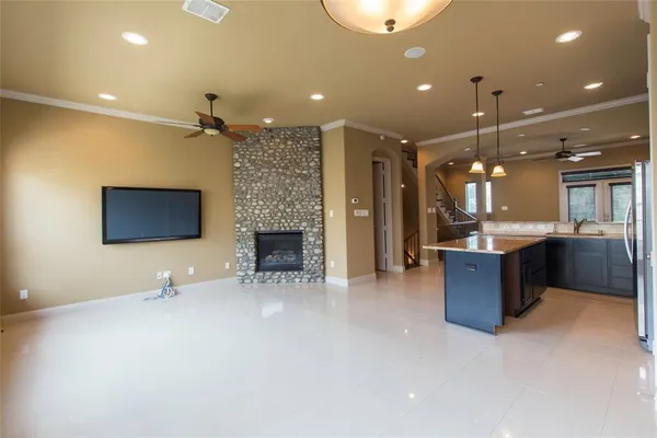 a lobby with a couch and a fireplace