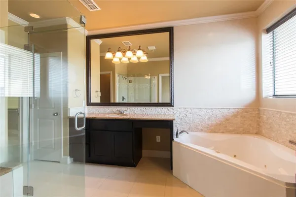a bathroom with a bathtub and a sink
