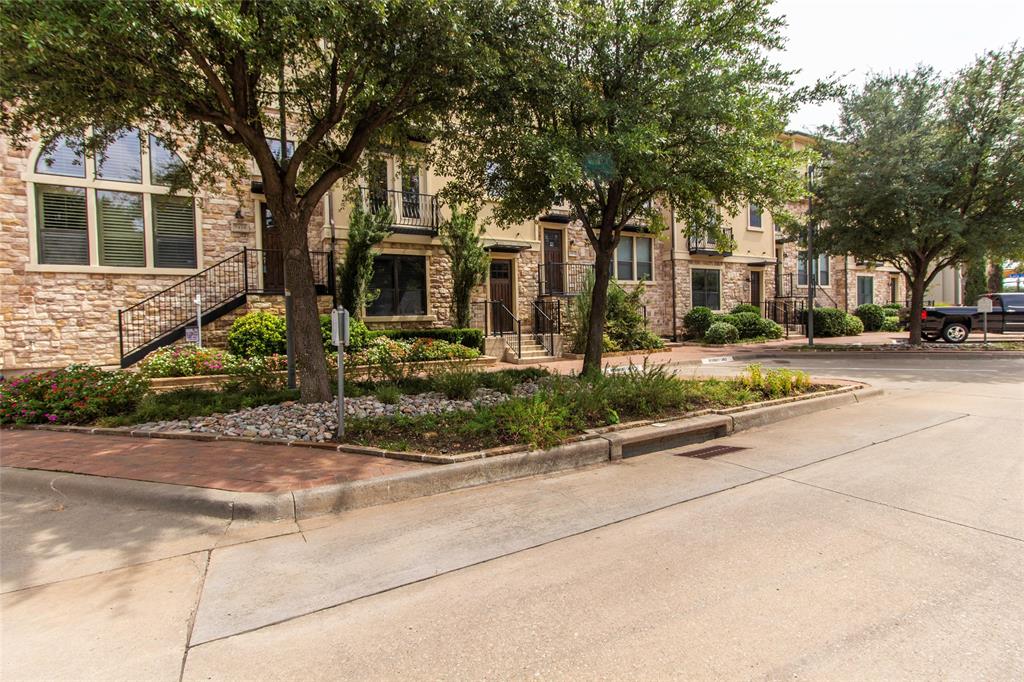 7416 Bishop Road Plano, TX 75024 - Photo 4 of 40 a front view of a house with a yard and potted plants