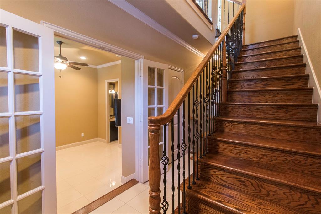 7416 Bishop Road Plano, TX 75024 - Photo 8 of 40 a view of entryway with wooden floor and stairs