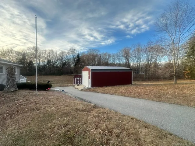 a view of backyard with tub