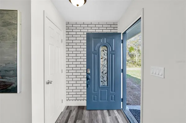a living room with furniture a fireplace and a table