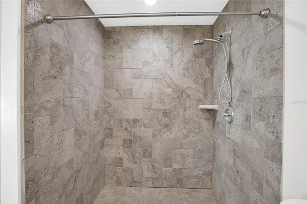 a bathroom with a shower and a toilet