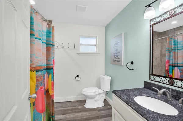 a bedroom with bed and a window