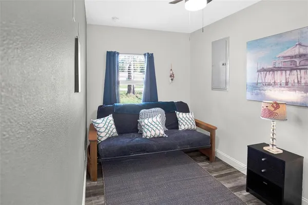 a bedroom with a bed and hallway