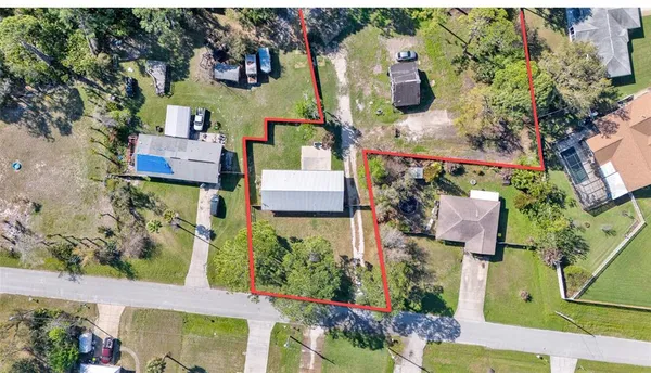 an aerial view of houses with outdoor space