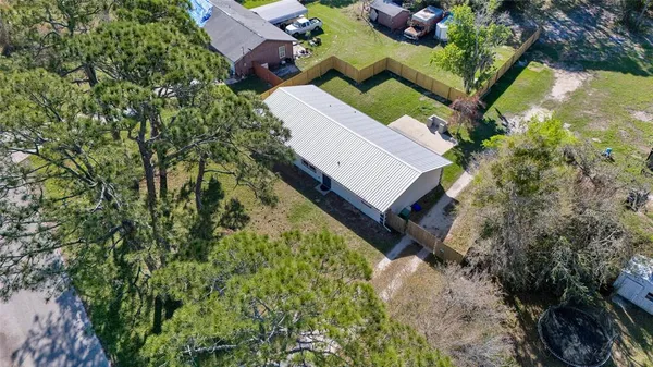a view of a house with a yard and sitting area