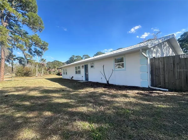a view of a back yard of the house