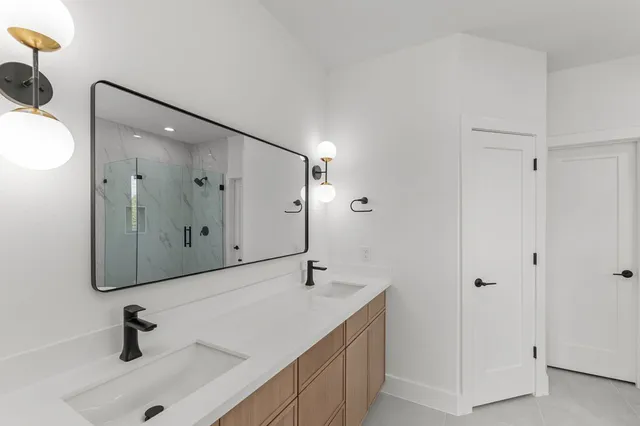 a bathroom with a bathtub and shower