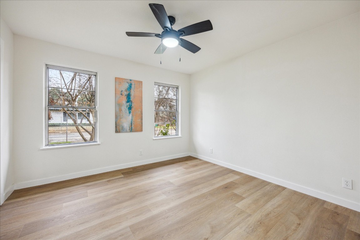 4608 Frontier Trail Austin, TX 78745 - Photo 13 of 30 wooden floor in an empty room with a window