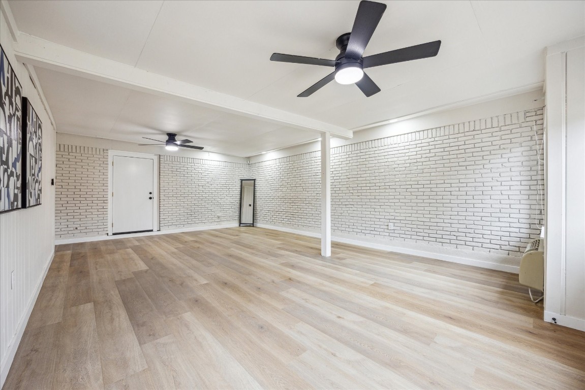 4608 Frontier Trail Austin, TX 78745 - Photo 24 of 30 a view of empty room with wooden floor and fan