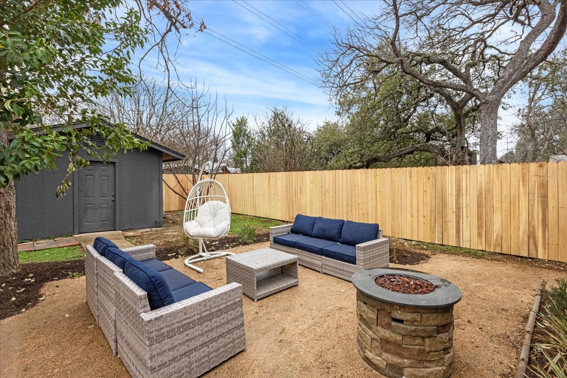 4608 Frontier Trail Austin, TX 78745 - Photo 27 of 30 a view of a backyard with furniture and a fire pit