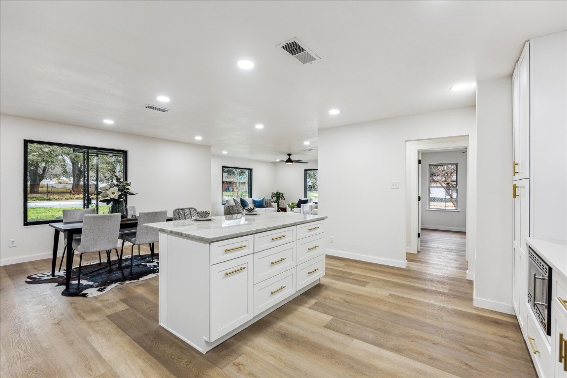 4608 Frontier Trail Austin, TX 78745 - Photo 6 of 30 a room with stainless steel appliances kitchen island hardwood floor and a window