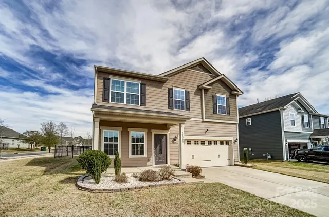 a front view of a house with garden