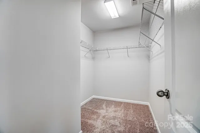 a view of a room with racks on the wall