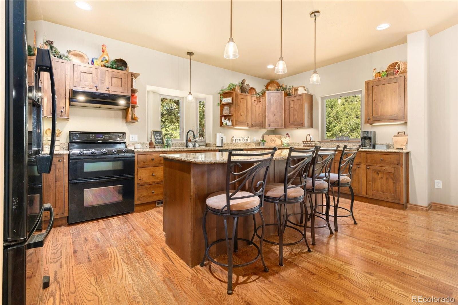 990 Hamilton Creek Road Coaldale, CO 81222 - Photo 11 of 49 a large kitchen with a table and chairs