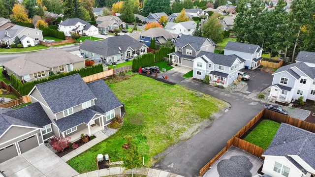 an aerial view of a house with a garden