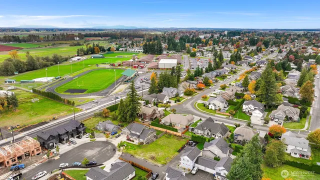 an aerial view of a city with lawn chairs