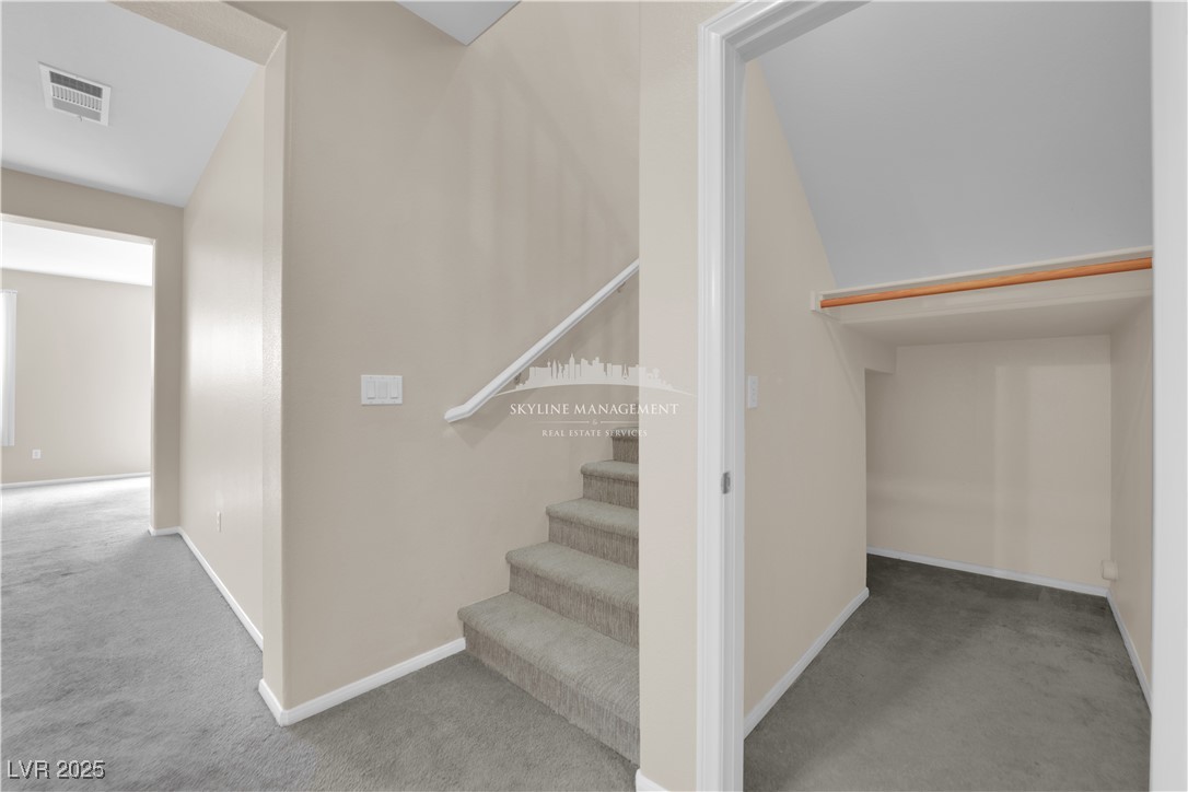 8661 Rowland Bluff Avenue Las Vegas, NV 89178 - Photo 16 of 37 Staircase with carpet floors