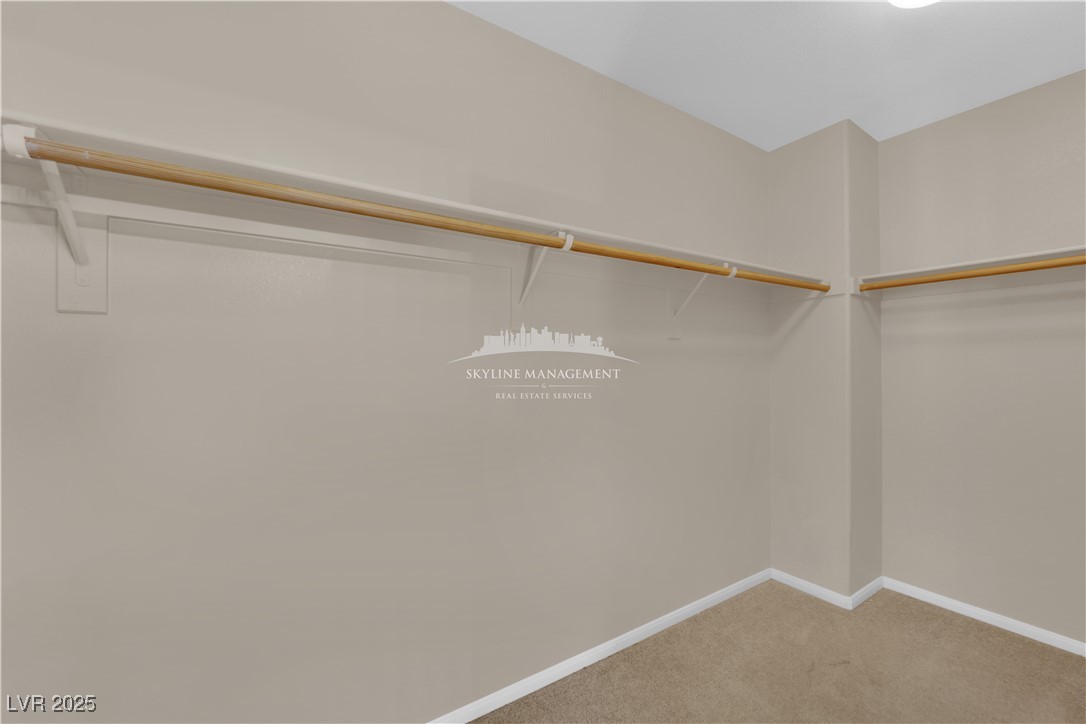 8661 Rowland Bluff Avenue Las Vegas, NV 89178 - Photo 30 of 37 Walk in closet with light colored carpet