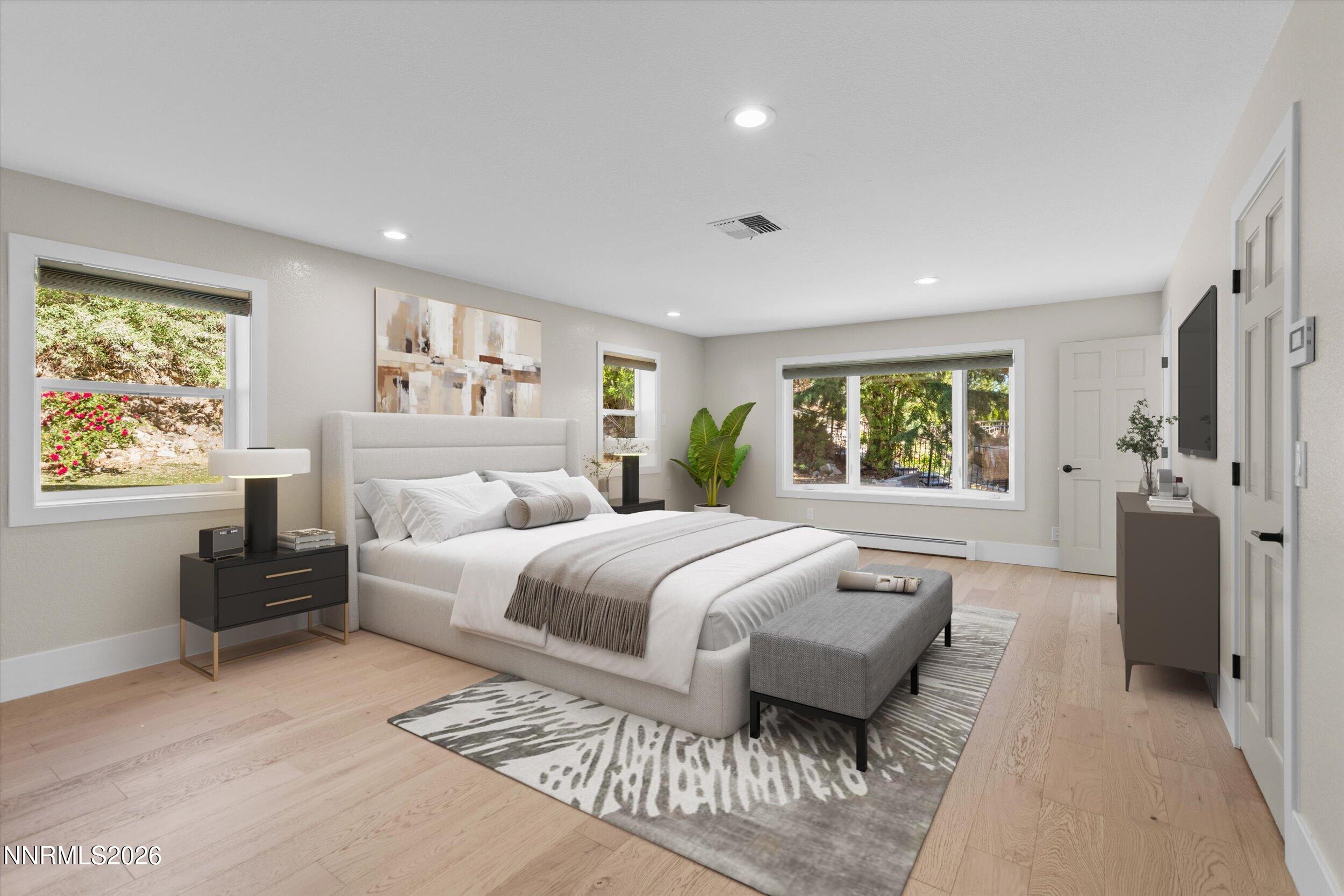 2725 West Lake Ridge Shores Reno, NV 89519 - Photo 22 of 49 a spacious bedroom with a large bed and a couch
