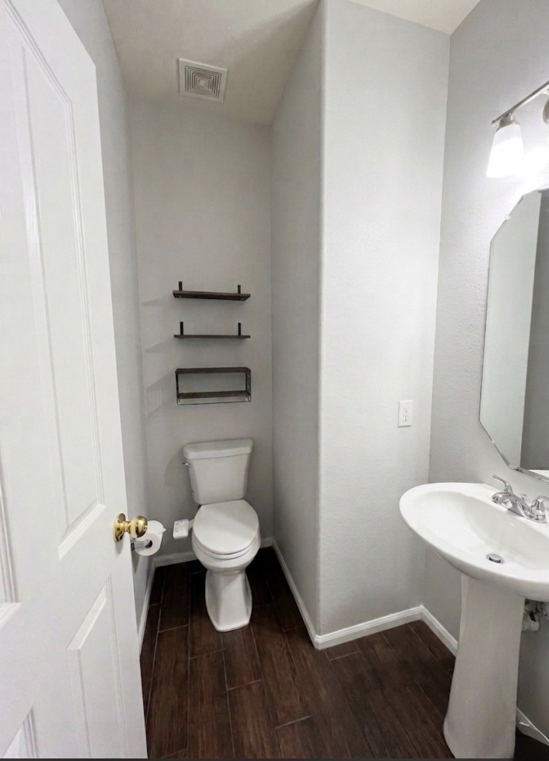 9908 Climbing Tree Street Conroe, TX 77385 - Photo 9 of 26 a bathroom with a toilet and a sink