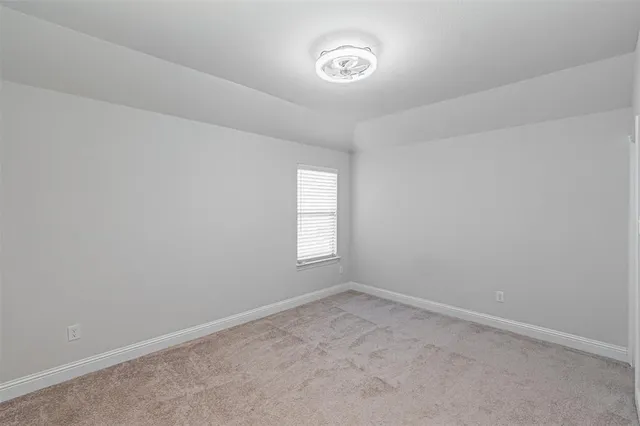 an empty room with a hallway