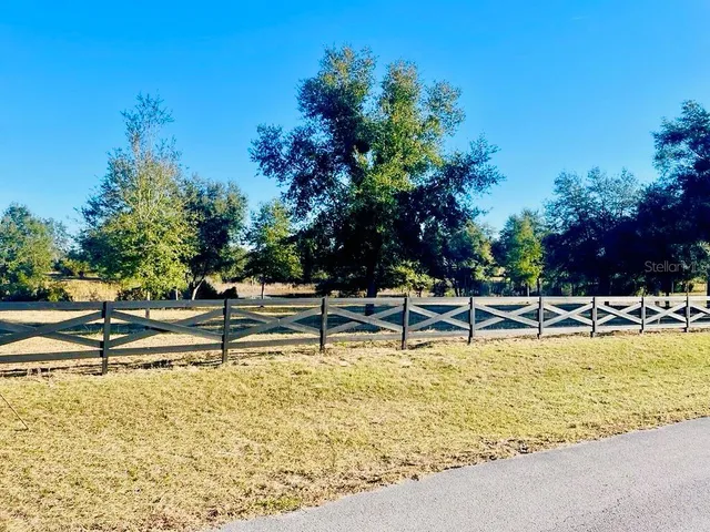 a view of a swimming pool with outdoor seating