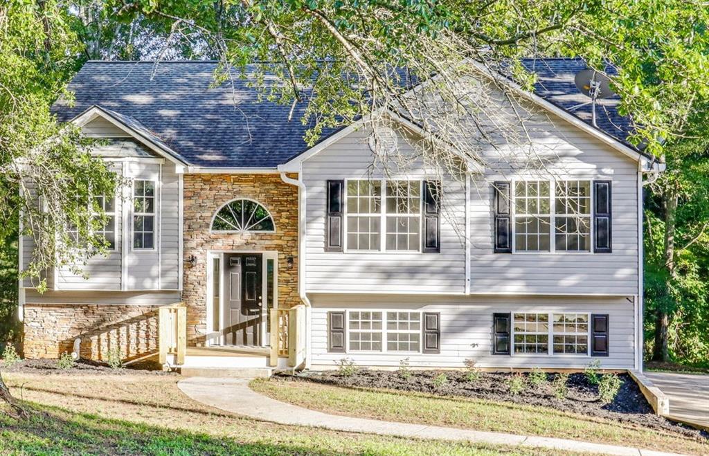 733 Wesley Chapel Road Villa Rica, GA 30180 - Photo 1 of 1 a front view of a house with a yard