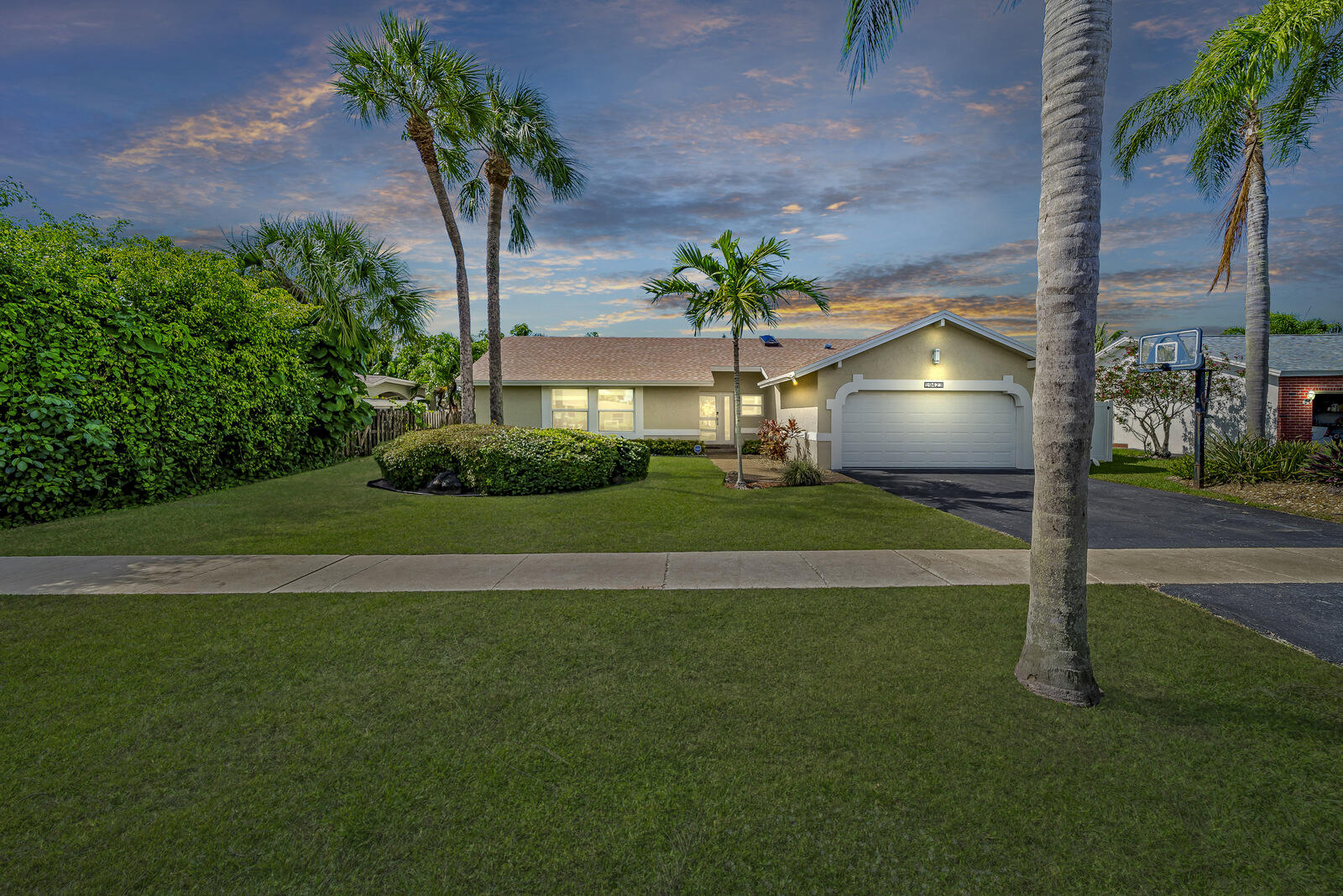 19423 Colorado Circle Boca Raton, FL 33434 - Photo 1 of 78 front in fun twilight