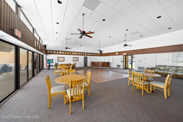 a view of a dining room with furniture window and outdoor view