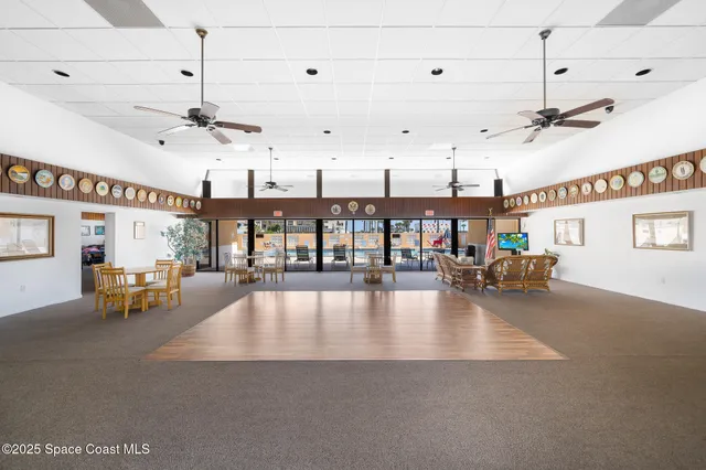 a view of a living room and kitchen