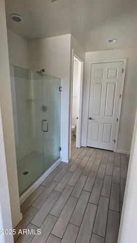 a view of a house with snow on the road