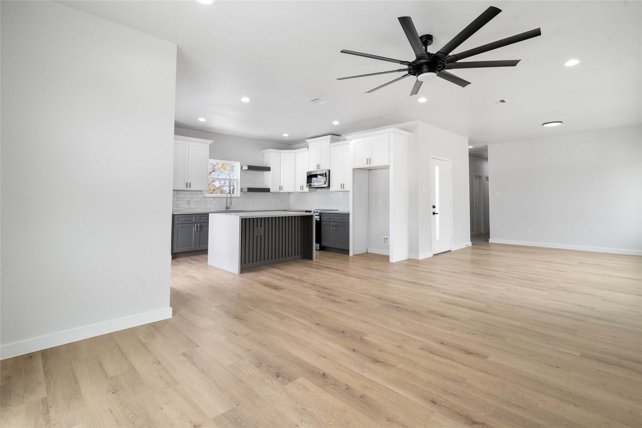 7220 South Hall Street, Unit B Houston, TX 77028 - Photo 11 of 34 a view of a kitchen with a sink and a refrigerator