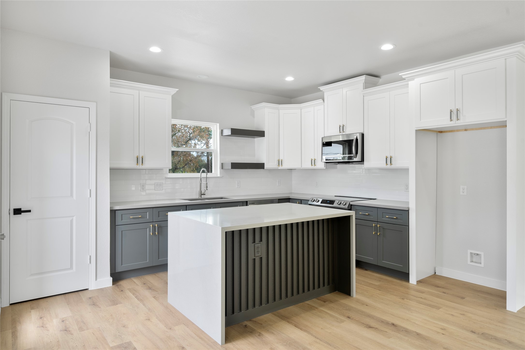 7220 South Hall Street, Unit B Houston, TX 77028 - Photo 13 of 34 a kitchen with stainless steel appliances granite countertop a stove and a refrigerator