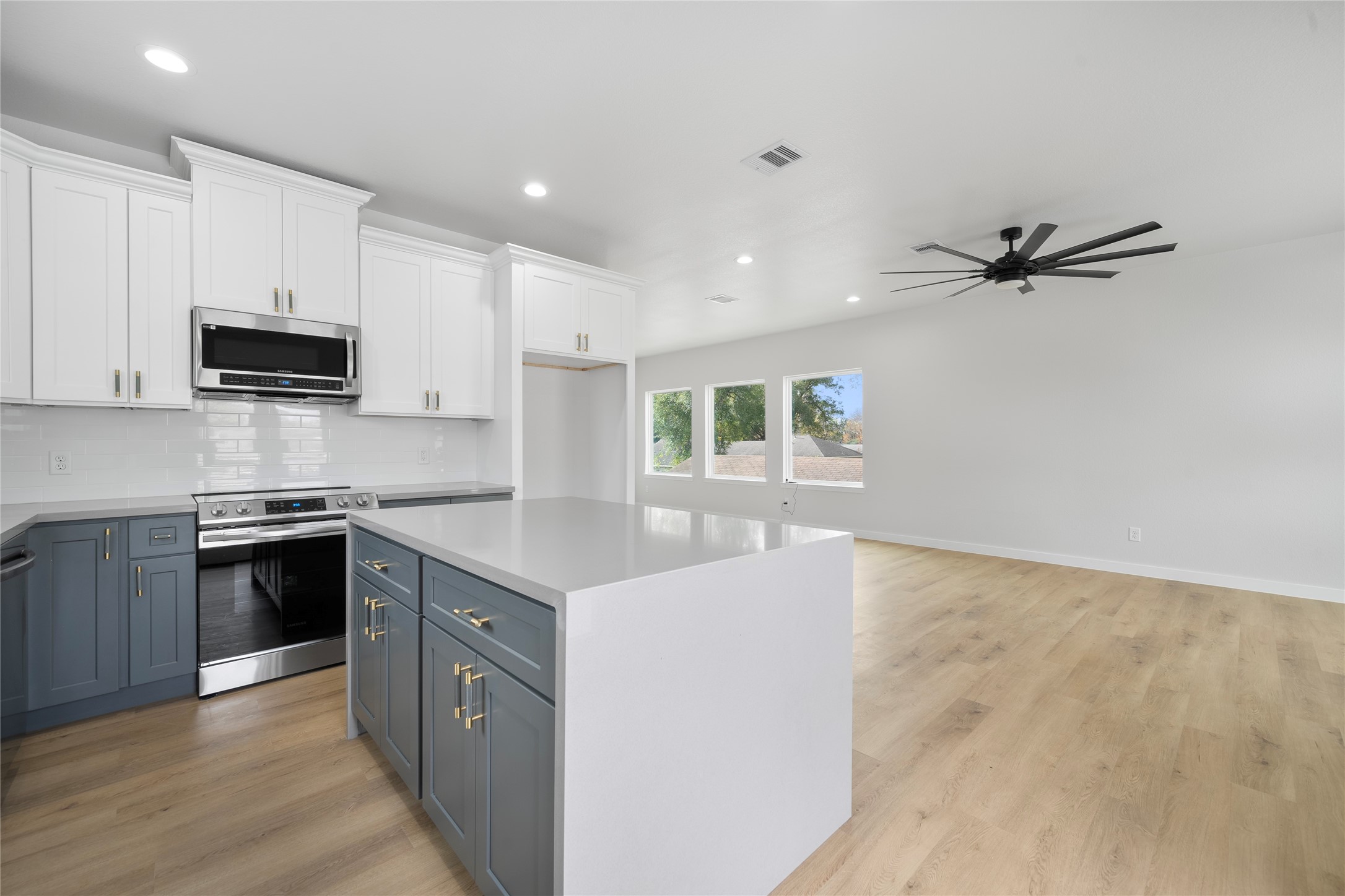 7220 South Hall Street, Unit B Houston, TX 77028 - Photo 16 of 34 a kitchen with stainless steel appliances granite countertop a sink stove and refrigerator