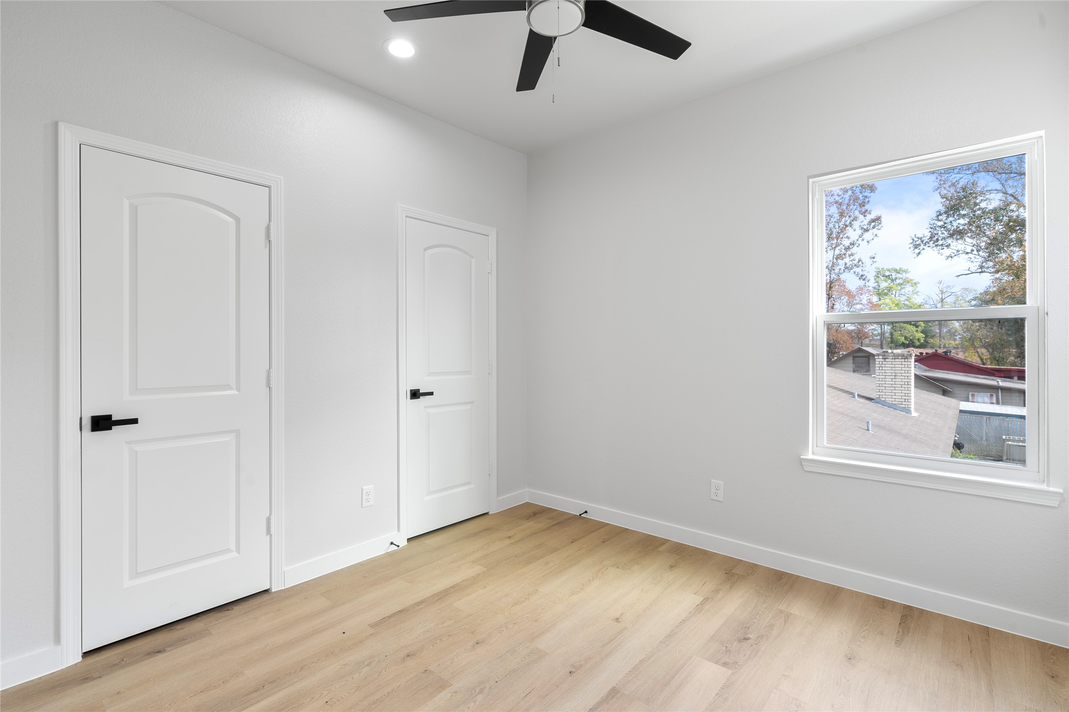 7220 South Hall Street, Unit B Houston, TX 77028 - Photo 19 of 34 wooden floor in an empty room with a window