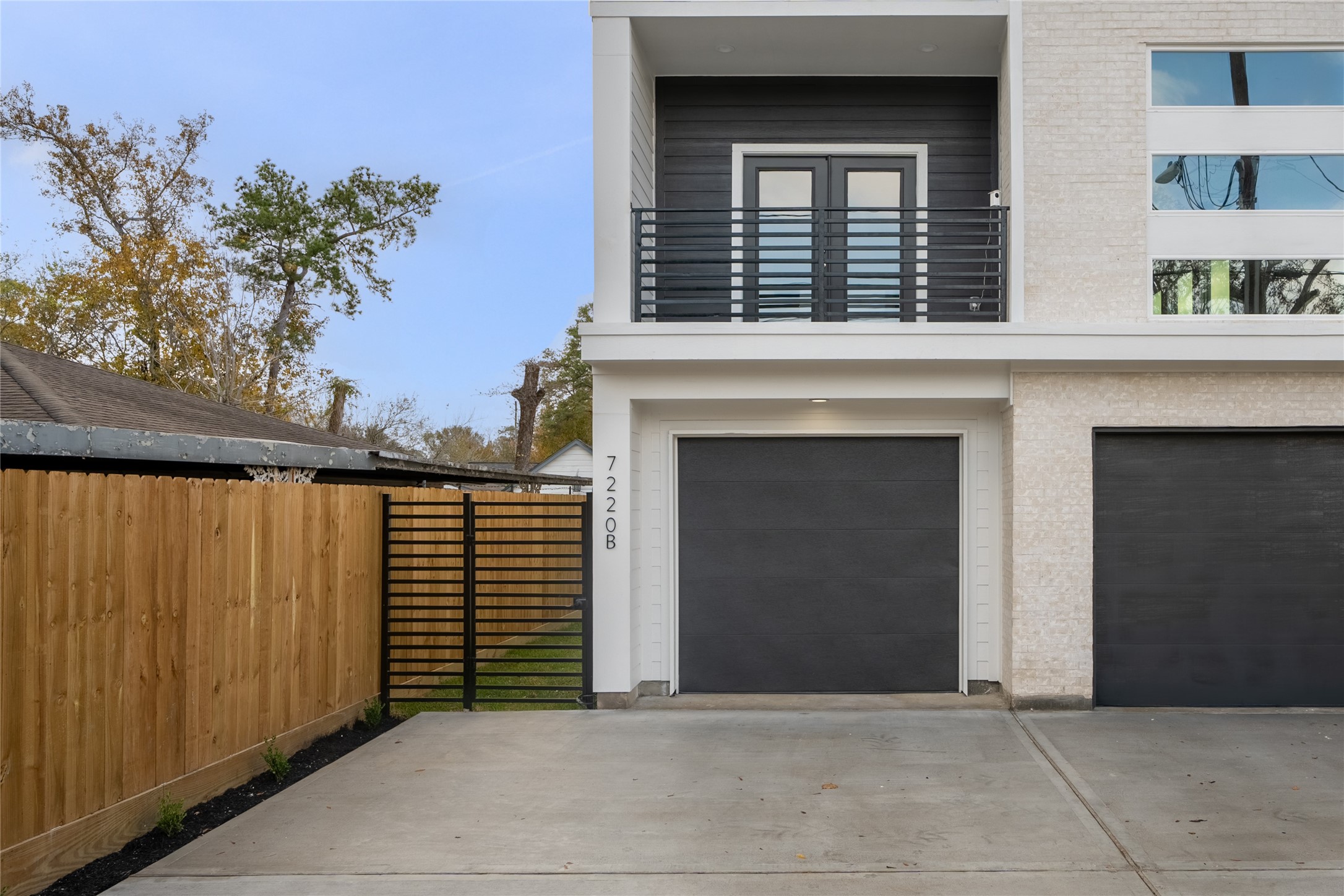 7220 South Hall Street, Unit B Houston, TX 77028 - Photo 2 of 34 a view of backyard with a large window and potted plants