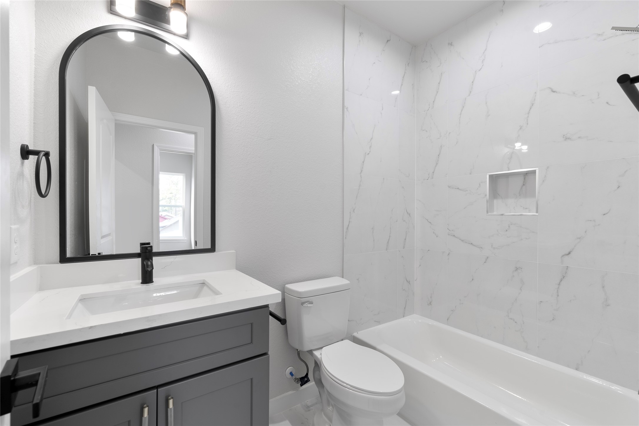 7220 South Hall Street, Unit B Houston, TX 77028 - Photo 23 of 34 a bathroom with a toilet a sink and mirror