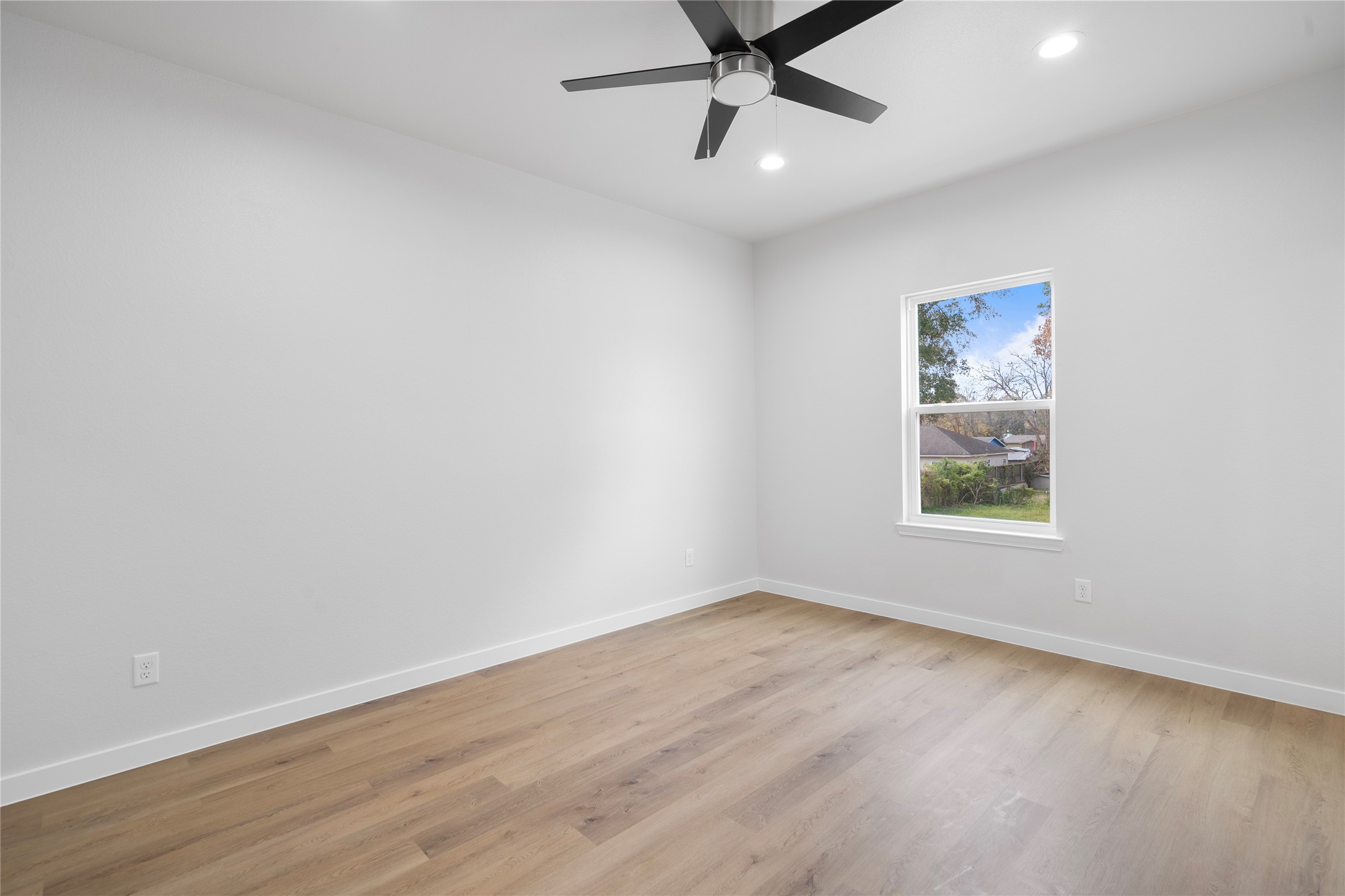 7220 South Hall Street, Unit B Houston, TX 77028 - Photo 24 of 34 an empty room with a window and a fan