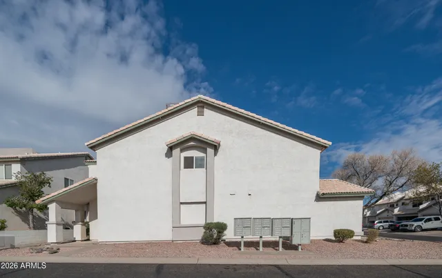 a view of a house with a street